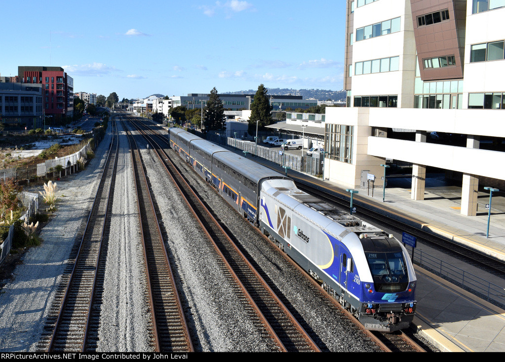 Caltrans owned SC-44 # 2103 shoves Amtrak Capitol Corridor Train # 540 out of Emeryville Station 